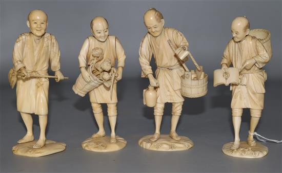 Four Japanese ivory figures of farmers